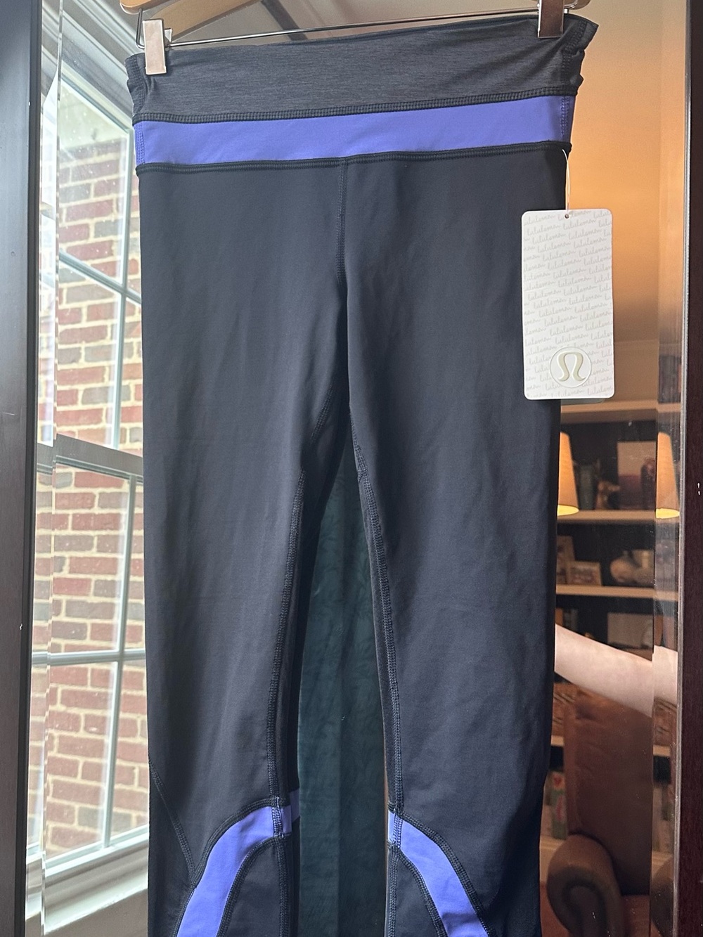 Lululemon Women's Black Leggings with Purple Trim. NWT.